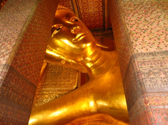 Gigantic reclining Buddha in  Wat Pho temple in Bangkok. 